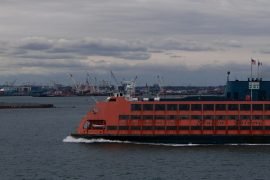 a large boat traveling across a large body of water